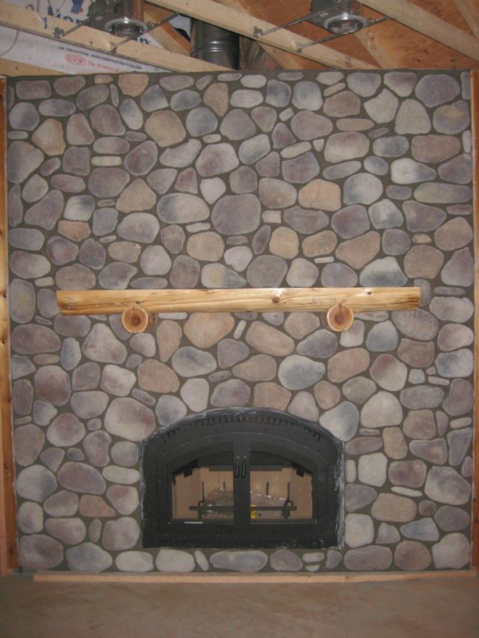 Stone veneer fireplace