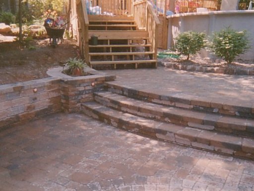 Stairway system and Paving Stone patio by above gound pool