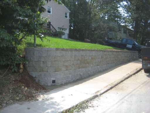 Retaining wall at roadside sidewalk