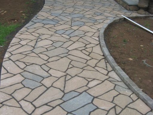 Paterned and curved stone walkways w edging